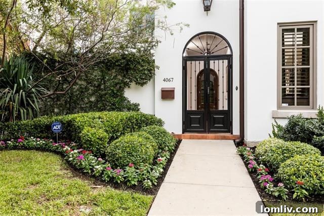 Exterior view of 4067 West 7th Street, showcasing its impressive Mediterranean architecture and landscaped surroundings.