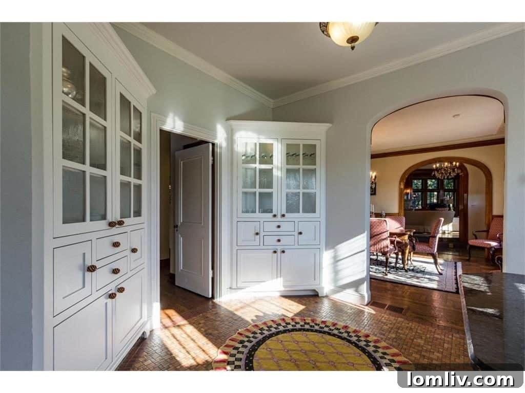 A contemporary kitchen featuring custom cabinetry, high-end appliances, and ample counter space, thoughtfully designed within the historic context.
