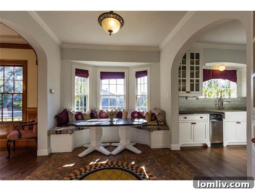 The charming breakfast nook area, with its original flooring and windows preserved.