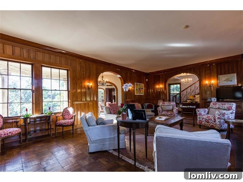 Detailed view of the exquisite woodwork and a cozy fireplace, highlighting the craftsmanship of the Tudor era.