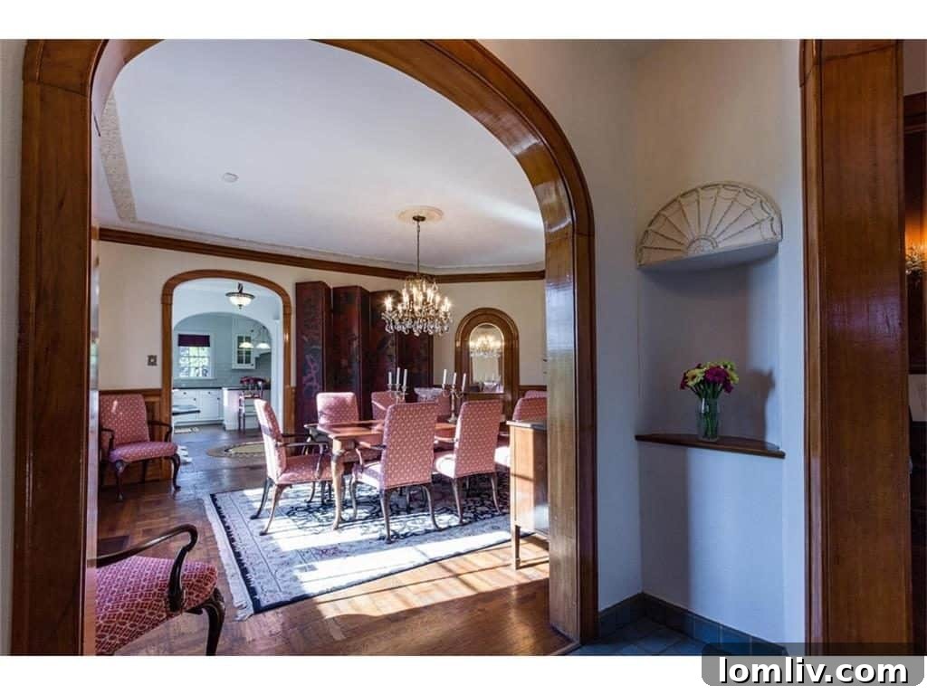Another perspective of the refined interior, emphasizing the elegant flow between rooms and the period-appropriate decor.
