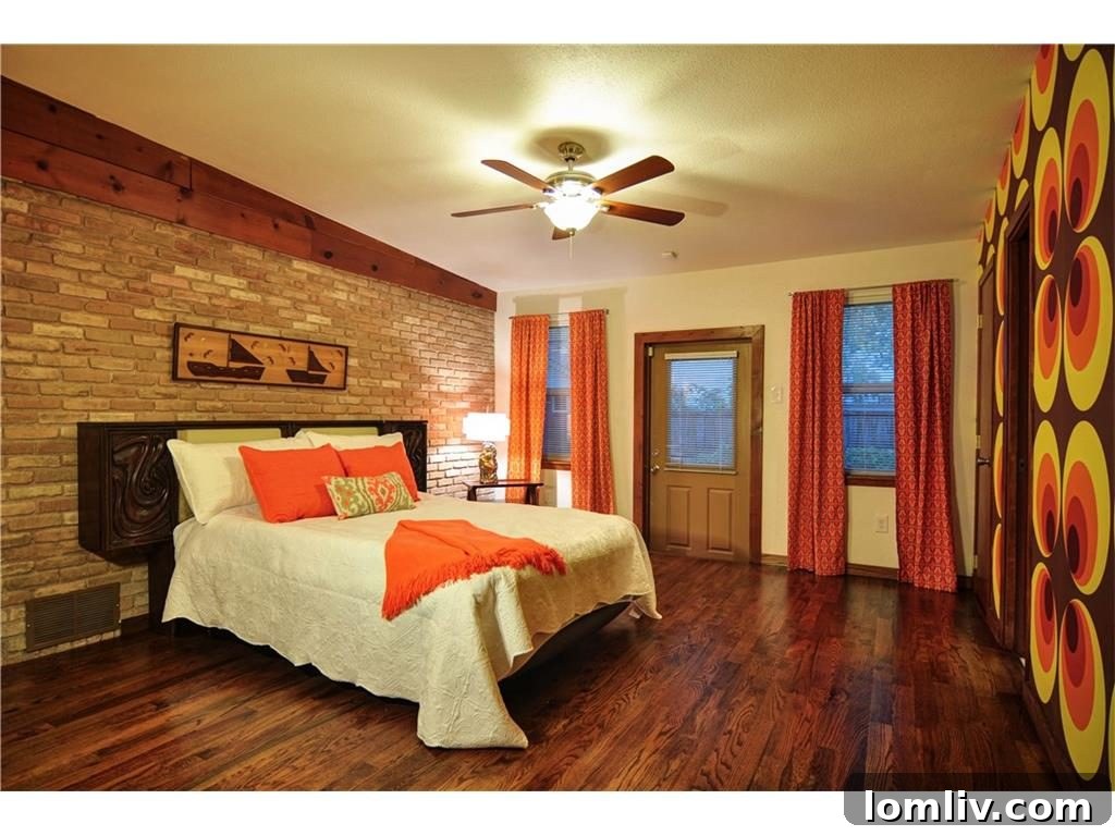 Guest bedroom suite adorned with vibrant, bold vintage wallpaper