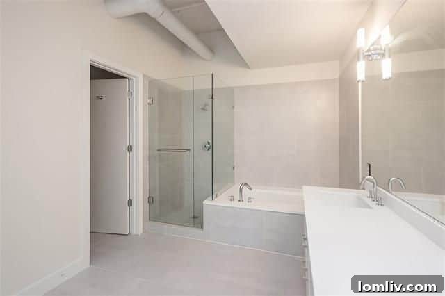 Luxurious master bathroom with separate tub and shower