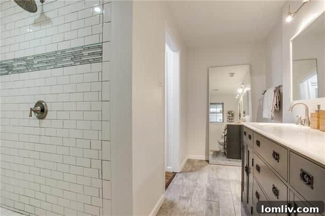 Hallway Leading to Bedrooms with Hardwood Floors