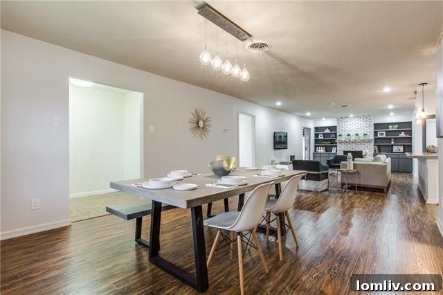 Contemporary Dining Area with Industrial Light Fixture