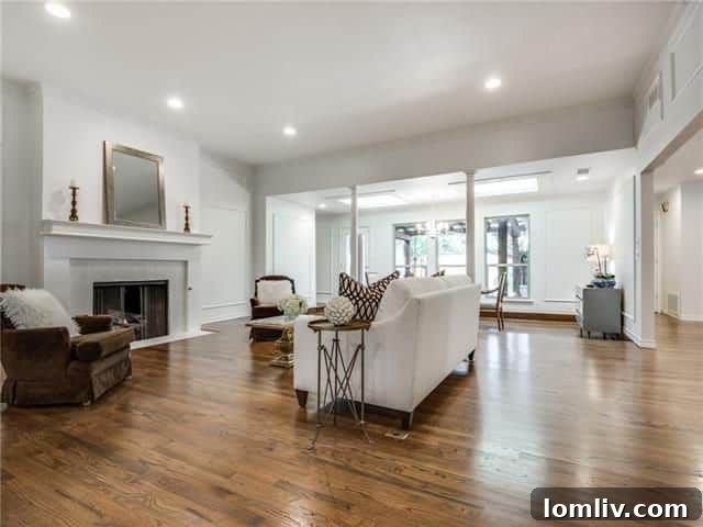 Belmont Craftsman Shines Bright in This Week's Dallas Open House Roundup 14 Bright and open living room with a high ceiling and wood-burning fireplace at 7103 Claybrook Dr.