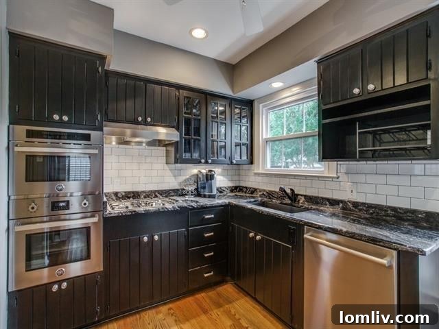 Belmont Craftsman Shines Bright in This Week's Dallas Open House Roundup 24 Modern kitchen with a farmhouse sink, convection oven, gas cooktop, and granite countertops at 6029 Penrose Ave.