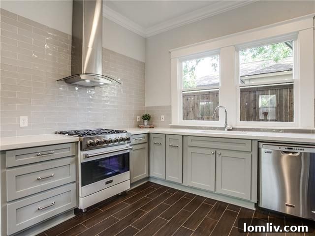 Belmont Craftsman Shines Bright in This Week's Dallas Open House Roundup 5 Spacious living area of 5803 Richmond Ave, showcasing refinished hardwood floors and designer lighting.