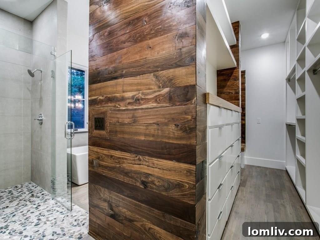 Lakewood Creekside Farmhouse: Modern Texas Living 16 Contemporary bedroom with large windows offering natural views.