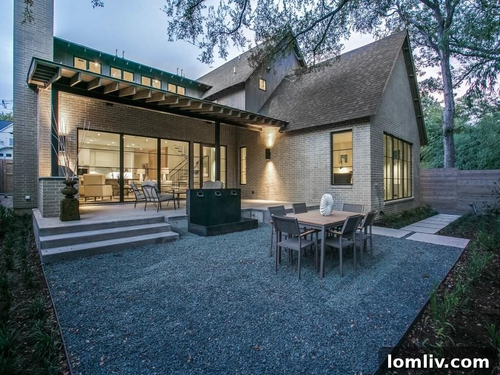 Lakewood Creekside Farmhouse: Modern Texas Living 18 Stunning double-sided steel fountain, a focal point in the meticulously landscaped backyard.
