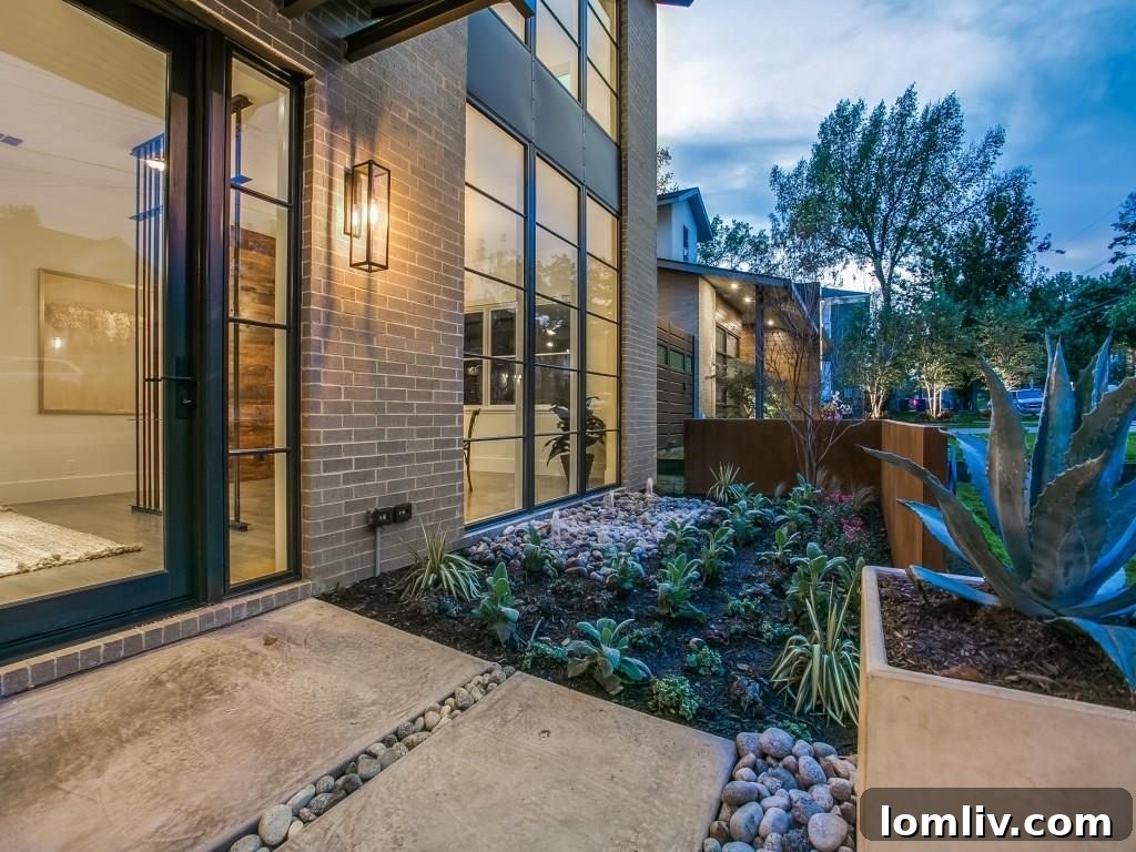 Lakewood Creekside Farmhouse: Modern Texas Living 3 Expansive living area at 6726 Lake Circle Drive, featuring large windows and an open-plan layout connecting to the outdoors.