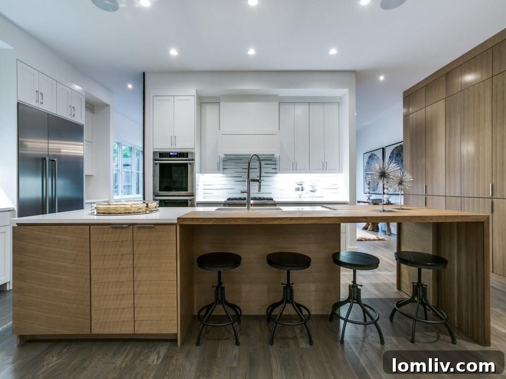 Lakewood Creekside Farmhouse: Modern Texas Living 9 Gourmet kitchen featuring a solid maple butcher block waterfall island and a wall of rift cut oak cabinets.