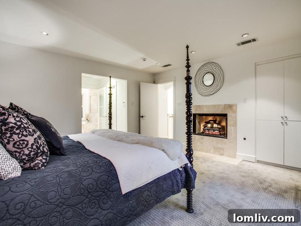 Frank Welch Protégé Redefines Texas Contemporary in Lake Park Estates 16 Serene bedroom with ample light and tasteful decor, providing a peaceful retreat.