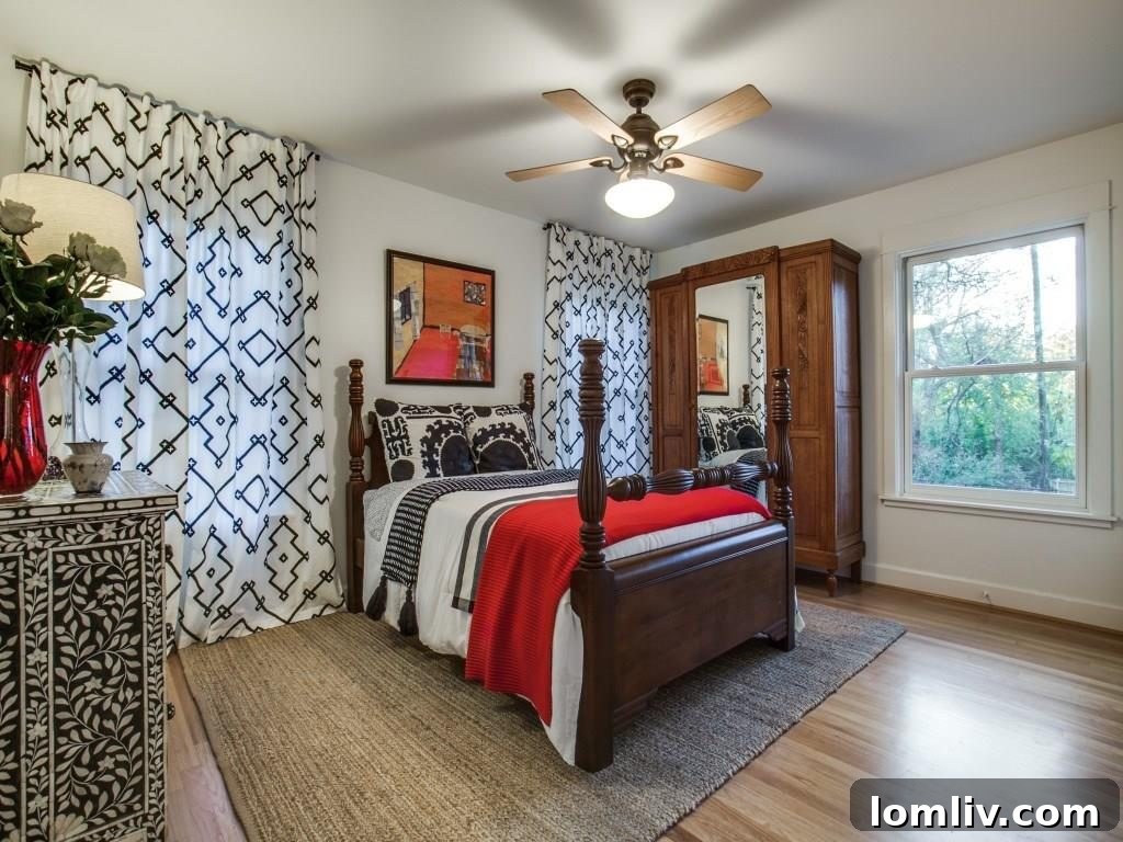 Frank Welch Protégé Redefines Texas Contemporary in Lake Park Estates 19 Inviting bedroom with a focus on comfort and natural light, perfect for relaxation.