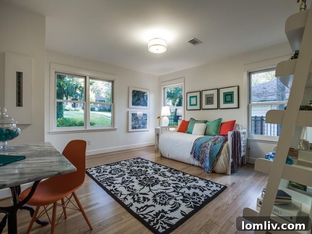 Frank Welch Protégé Redefines Texas Contemporary in Lake Park Estates 20 Bright and functional secondary workspace or reading nook, demonstrating the home's versatile design.