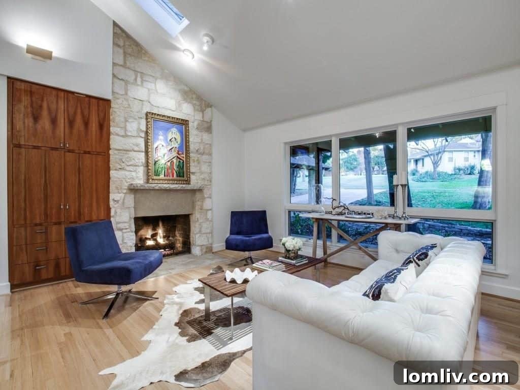Frank Welch Protégé Redefines Texas Contemporary in Lake Park Estates 7 A cozy yet modern seating area, showcasing the use of texture and light within the open layout.