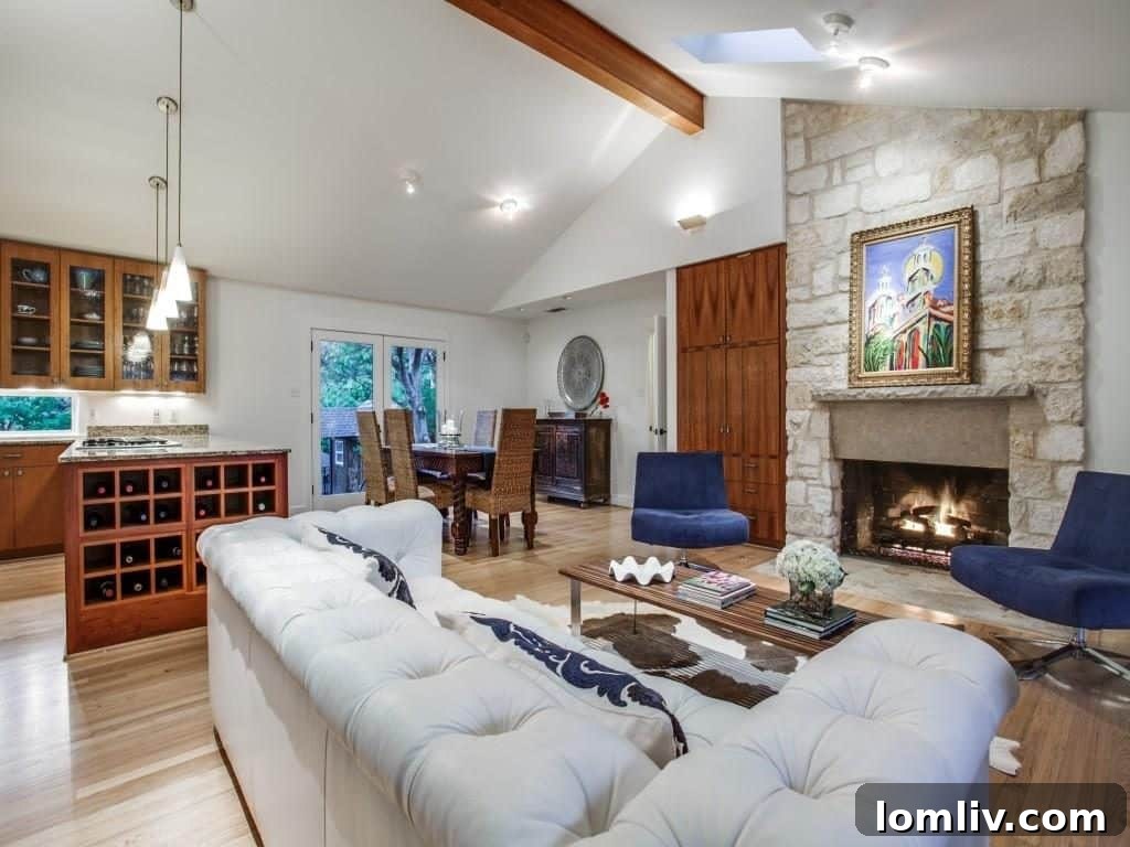 Frank Welch Protégé Redefines Texas Contemporary in Lake Park Estates 8 Elegant dining space adjacent to the living area, featuring contemporary lighting and easy access to the kitchen.
