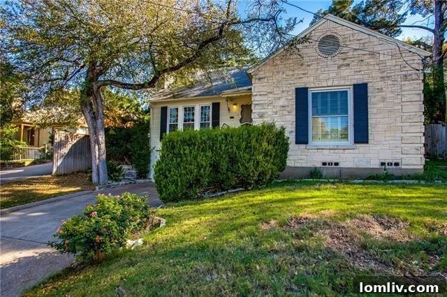 Charming Austin Stone Traditional Home Exterior at 714 N. Hampton Rd, West Kessler Heights