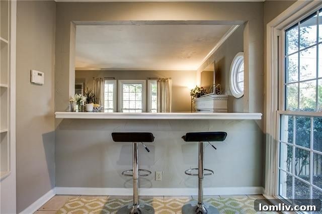 Second Bedroom with Unique Architectural Details and Ample Light