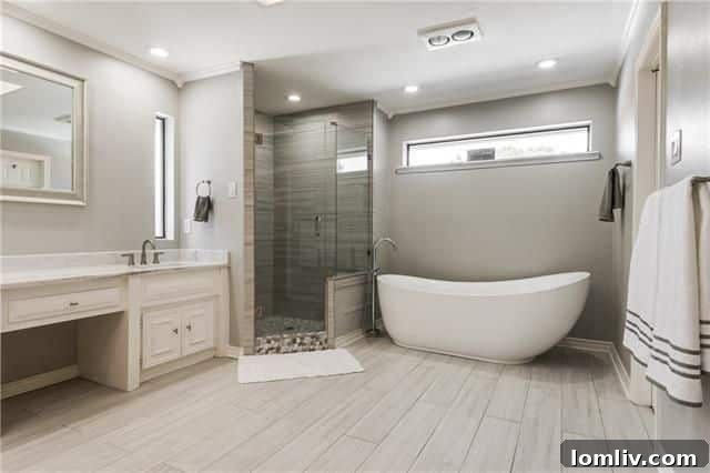 Luxurious master bathroom with large soaker tub at 7018 Lattimore Dr.