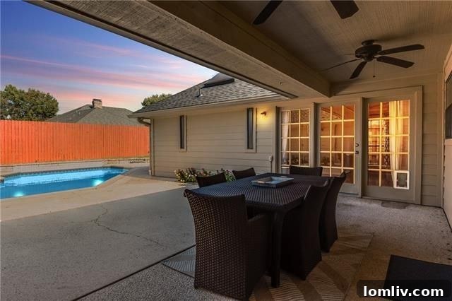 Backyard swimming pool and mature trees at 7018 Lattimore Dr.