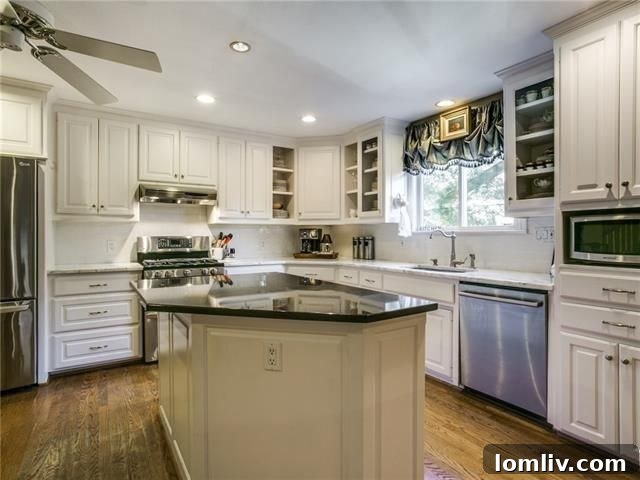 Elegant open kitchen with marble countertops at 6303 Martel Ave.