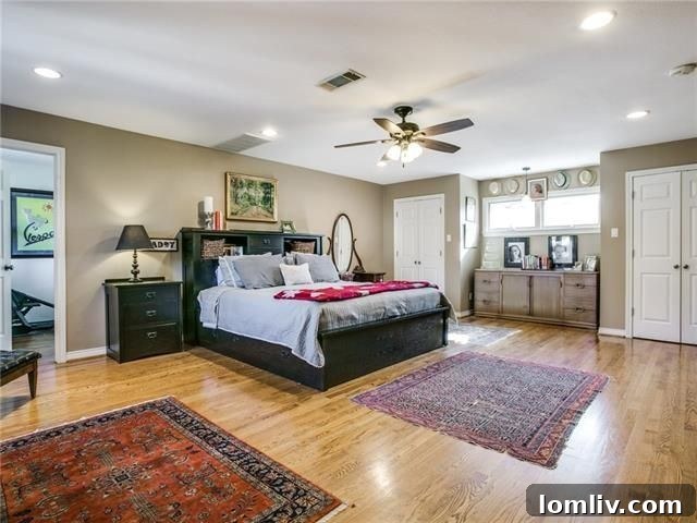 Spacious master bedroom with fireplace and seating area at 6303 Martel Ave.