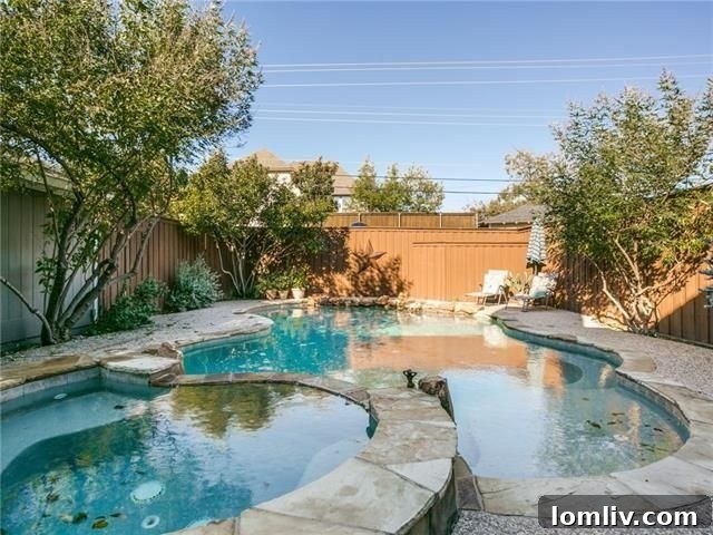Backyard swimming pool and covered patio at 6303 Martel Ave.