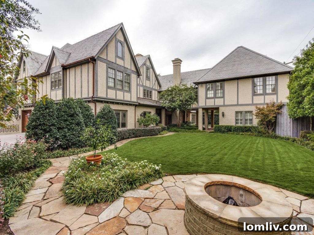 Beautifully landscaped backyard with lush greenery, pathways, and mature trees