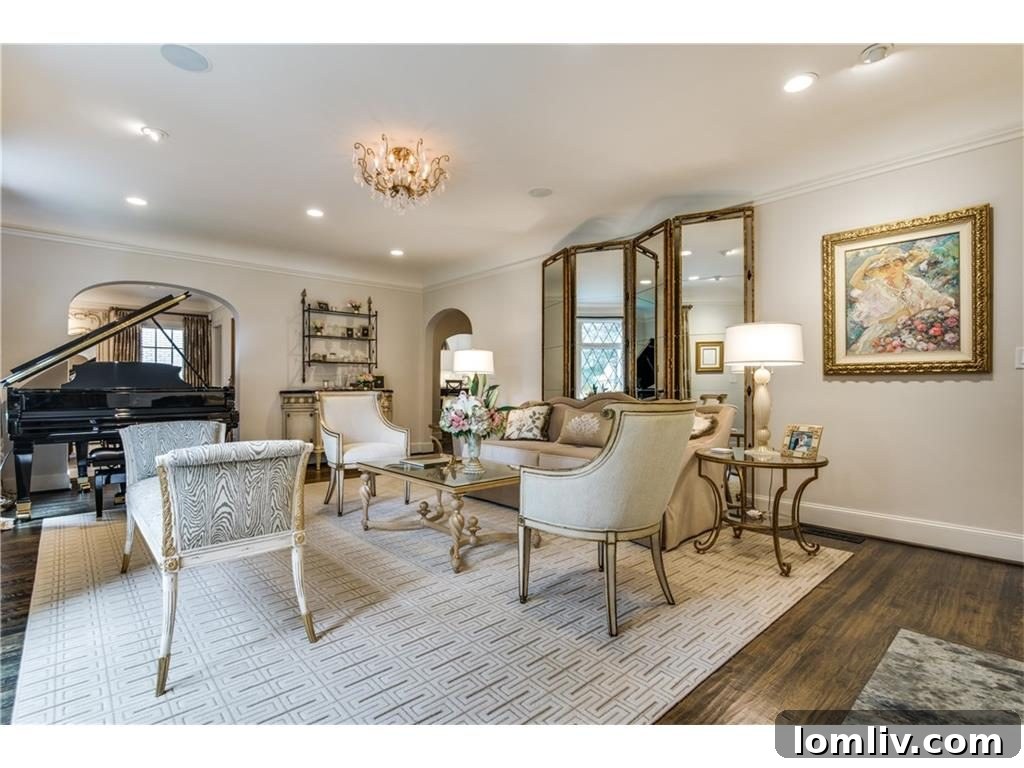 Elegant study or home office with custom built-ins, dark wood finishes, and a spacious desk