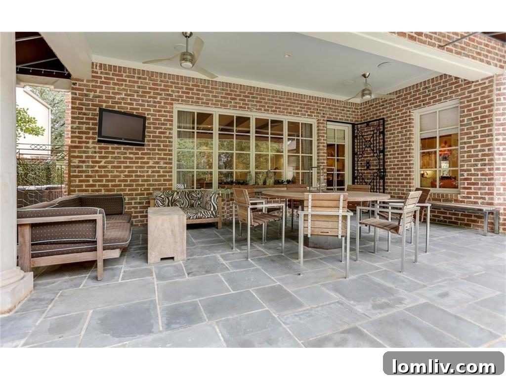 Well-maintained backyard with green lawn, offering private outdoor space