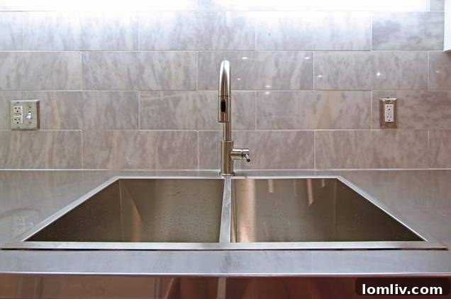 Detailed shot of the kitchen's five-burner stainless steel range and built-in microwave vent hood.