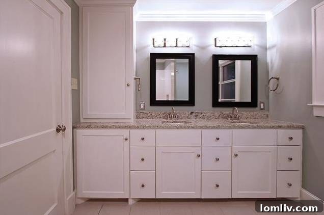 View of the expansive walk-in shower in the master bathroom, featuring modern tiling.