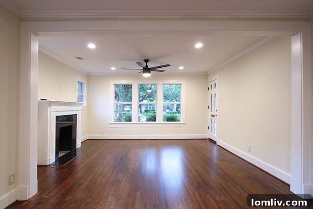 Another view of the living room, highlighting the open concept and modern aesthetic of the renovation.
