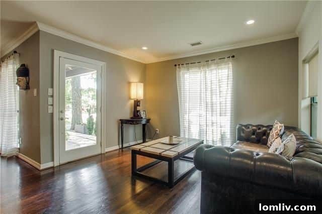 5220 Parkland Avenue: Entryway with sofa facing front door, humorous staging
