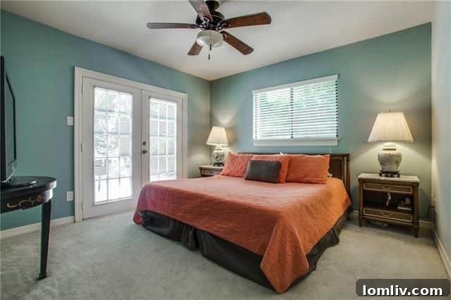 5220 Parkland Avenue: King-size master bedroom with French doors and abundant light