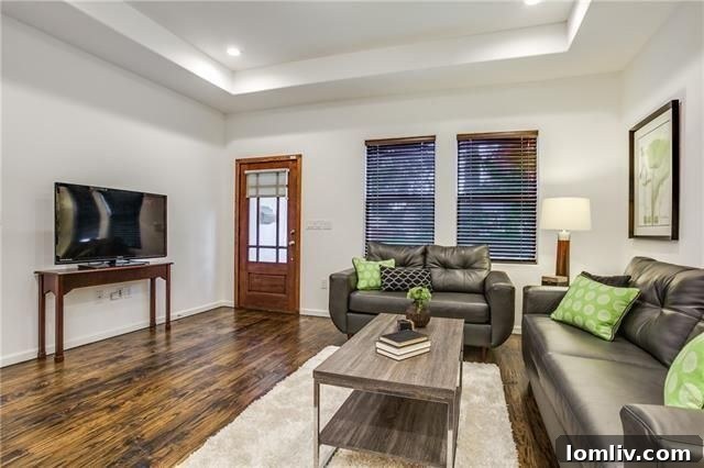 5218 Denton Drive: Renovated living room with new floors and recessed lighting