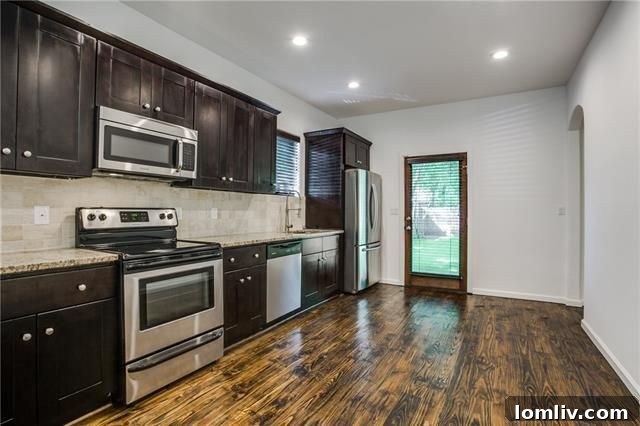 5218 Denton Drive: Modern kitchen with updated appliances and eat-in space