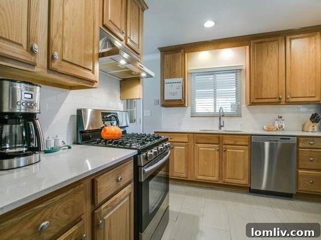 907 Tipperary Kitchen View 2 - Subway Tile Backsplash and Oak Cabinetry