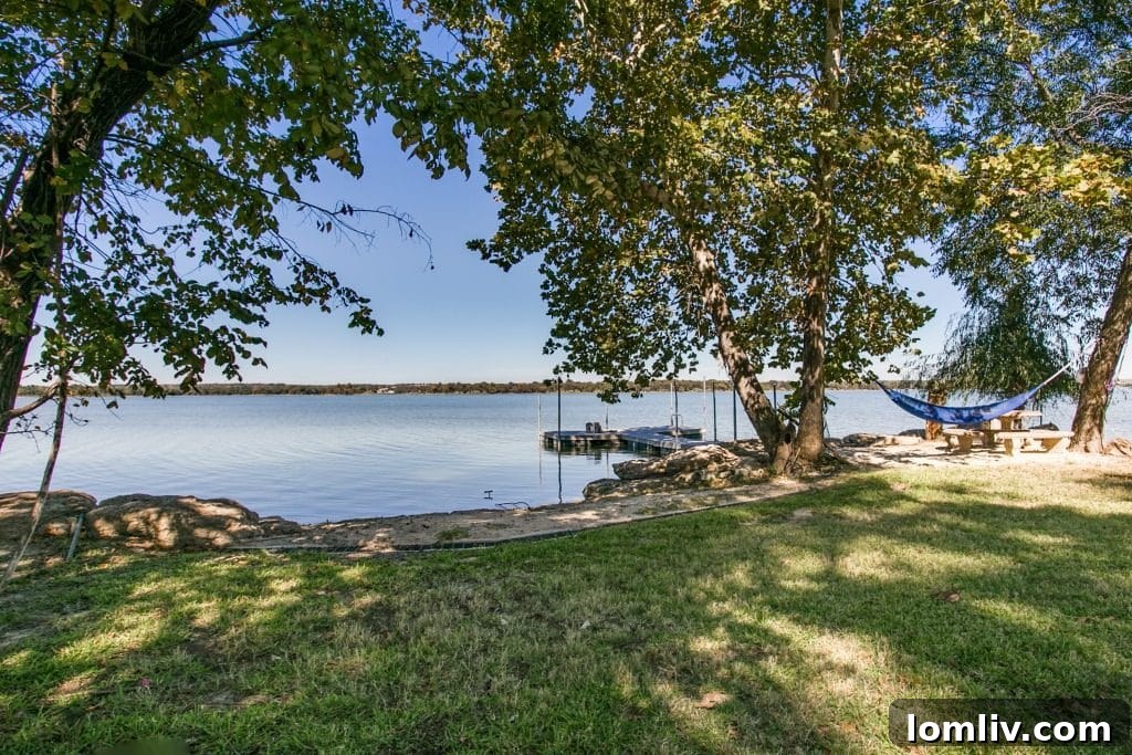 The Lakefront Side of Fort Worth You Never Knew 8 Private sandy beach and boat dock at 9212 Heron Drive, offering direct lake access and recreational opportunities