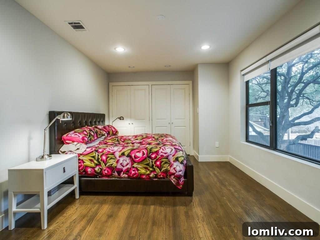 A comfortable and bright upstairs bedroom, perfect for children or guests, with ample space and modern decor.