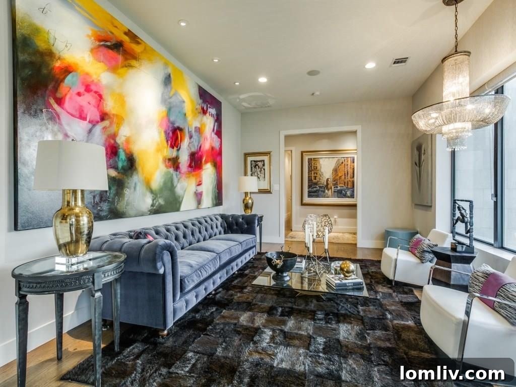 The grand living room at 11414 Parkchester Drive, showcasing its expansive layout, elegant fireplace, and sophisticated art lighting, designed for comfort and style.