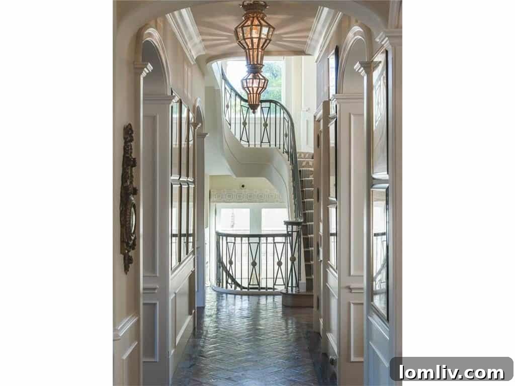 Elegant Staircase and Elevator Access to All Floors