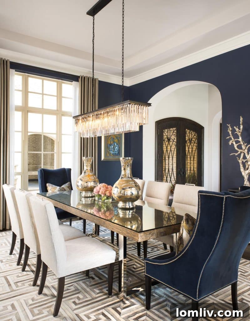 Elegant dining room with midnight blue walls and modern furnishings