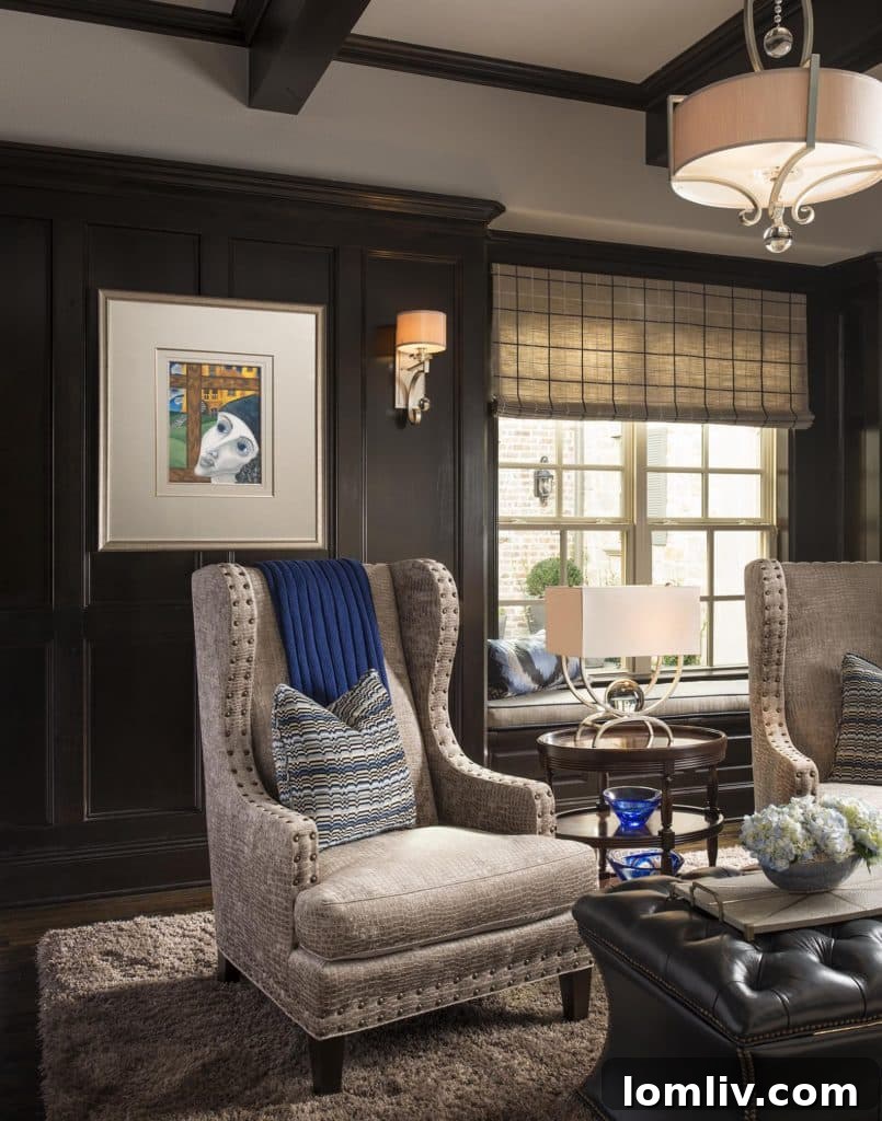 Luxurious library with wing chairs, leather ottoman, and dark wood paneling