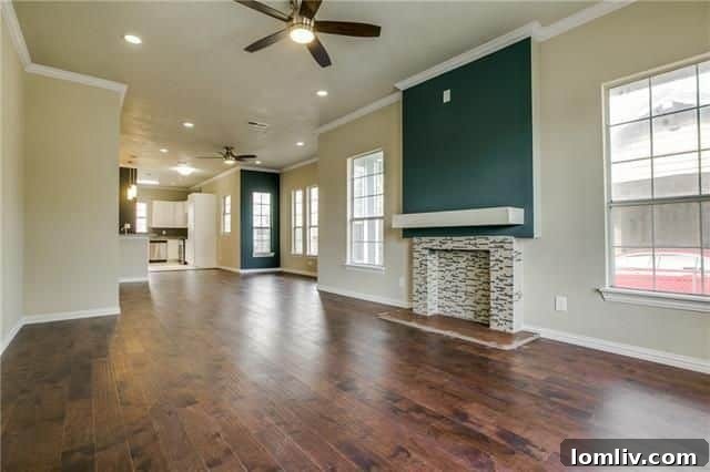 Bright and spacious living room with custom blue fireplace at 423 S. Waverly Drive