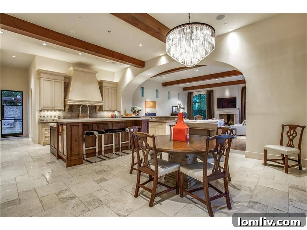 Bright and airy breakfast area overlooking the beautiful backyard, adjacent to the gourmet kitchen