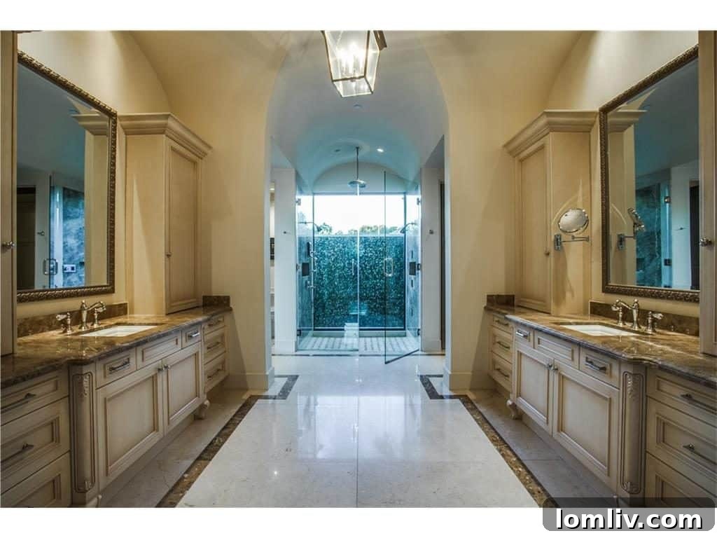 Elegant master bathroom with dual vanities and luxurious finishes