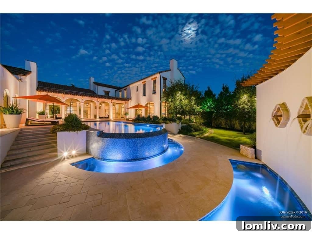 Panoramic view of the infinity pool and patio, highlighting the seamless indoor-outdoor living