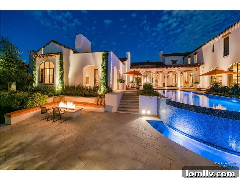 Another perspective of the home's rear exterior and lush backyard, emphasizing privacy and elegance